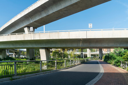Concrete structure and asphalt road space under the overpass in the city
