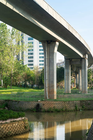 Concrete structure and asphalt road space under the overpass in the city