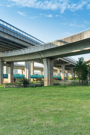 Looking up at a Large Interstate Highway Overpass and Blue Skyの写真素材