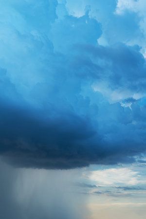 the dark clouds make the sky in black. The rain is coming soon.