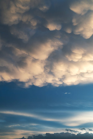 The dark clouds make the sky appear dark. Rain is coming soon.