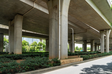 Concrete structure and asphalt road space under the overpass in the city