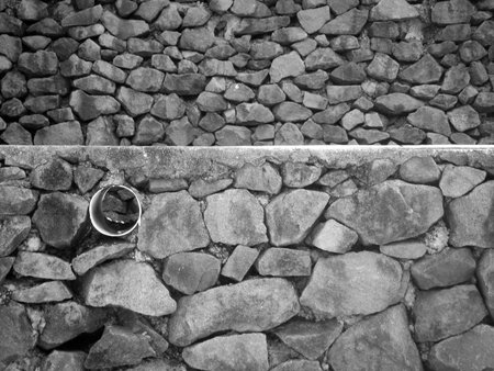 two walls made of stone captured in black and white