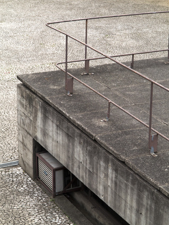concrete platform corner with iron railingの写真素材