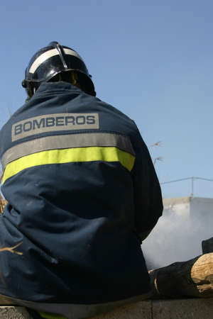 firefighter in a rural house fireの写真素材