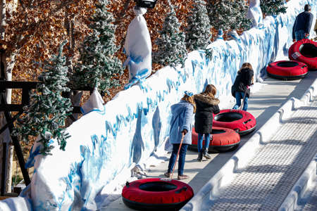 kids climbing sleds snow parkの写真素材
