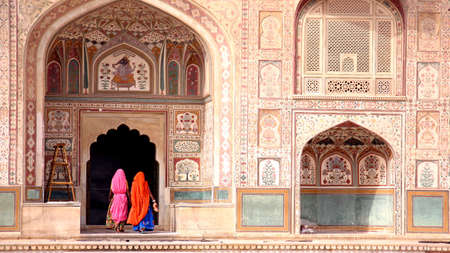 Two women walking in the Amber Fort, Jaipurの写真素材