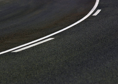 Road with white lines painted on the asphalt