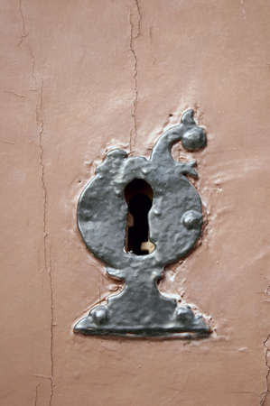 Old black metal lock on a door brownの写真素材