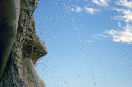 Detail of a fountain with water droplets in the airの写真素材