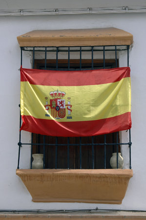 Flag of Spain at the window of a house in Andalusiaの写真素材