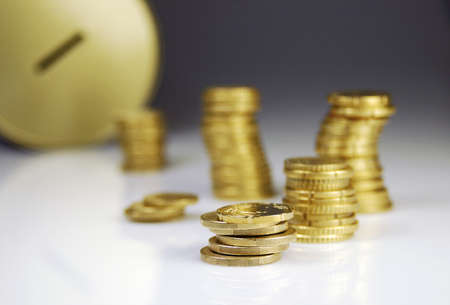 Coins and piggy bank to save money の写真素材