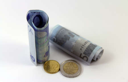 Small handful of money over white background defocusedの写真素材