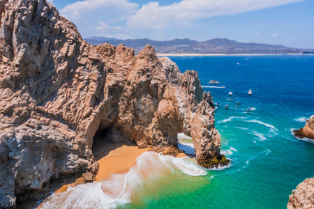 The Arch of Cabo San Lucas is an iconic rock formation in Baja California Sur, Mexico, where the Pacific Ocean and the Sea of Cortez meet.の写真素材