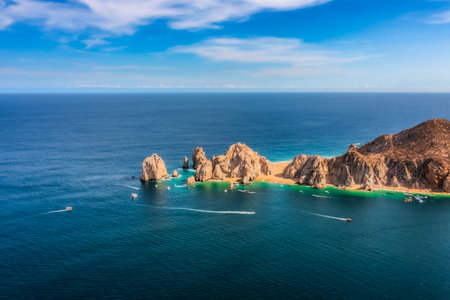 The Arch of Cabo San Lucas is an iconic rock formation in Baja California Sur, Mexico, where the Pacific Ocean and the Sea of Cortez meet.の写真素材
