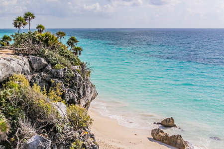 Playa Ruinas in the Archaeological Zone of Tulum, Quintana Roo, Mexico. A small beach of white sand and turquoise waters located where Mayan temples overlook the Caribbean.の写真素材