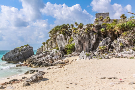 Playa Ruinas in the Archaeological Zone of Tulum, Quintana Roo, Mexico. A small beach of white sand and turquoise waters located where Mayan temples overlook the Caribbean.の写真素材