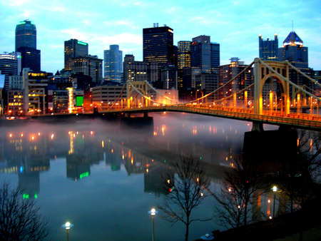 Downtown Pittsburgh accross the Allegheny River from the North Shore.early cool morning with reflexion of the 9th street bridge and city on riverの写真素材