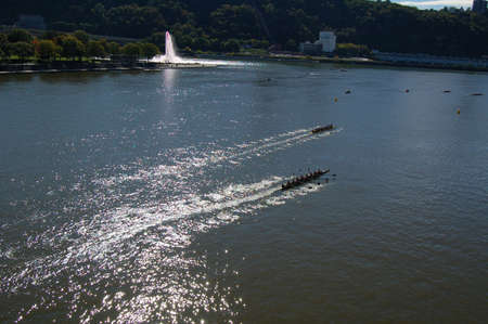Vickings race down the Allegheny River by the Point of Pittsburgh pennsylvaniaの写真素材