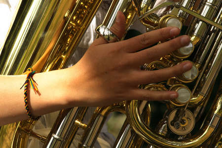 Girl hand playing a tubaの写真素材