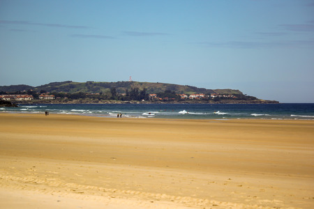 Sandy beach with the scenery of a capeの写真素材