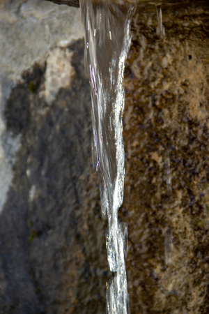 Fresh drinking water from a fountainの写真素材