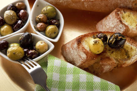 Close up of bread with olivesの写真素材