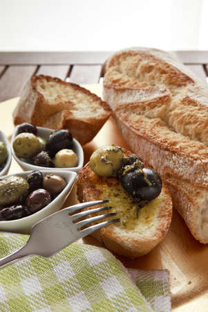 Close up of bread with olivesの写真素材