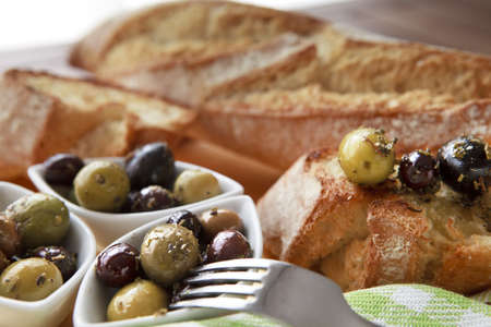 Close up of bread with olivesの写真素材
