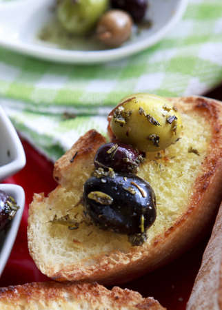 Close up of bread with olivesの写真素材