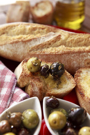 Close up of bread with olivesの写真素材