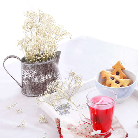 Christmas morning breakfast with tree cookies and flowersの写真素材