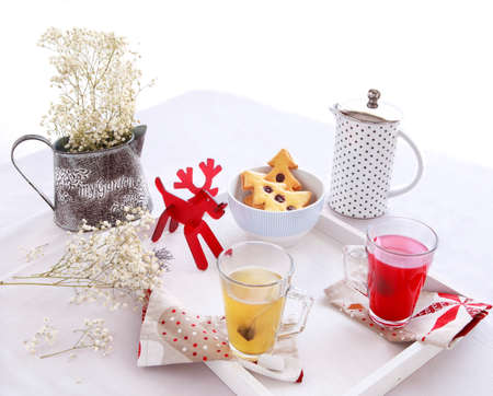 Christmas morning breakfast with tree cookies and flowersの写真素材