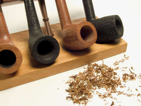 Pipes close-up with tobacco on a white backgroundの写真素材