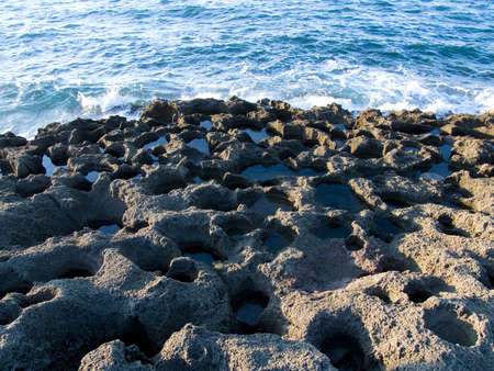 Photo about sea waves on the rocksの写真素材