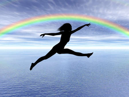 Black woman silhouette jumping in the rainbow landscapeの写真素材
