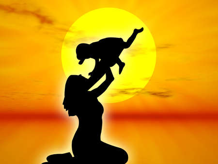 Mother and son in silhouette against the sunsetの写真素材