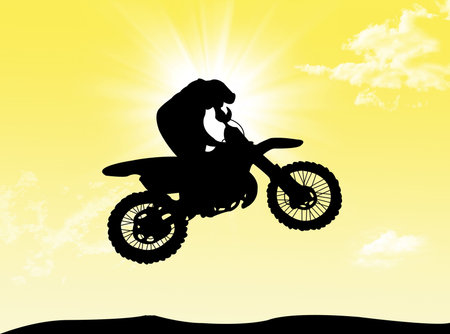 Biker jumping and have fun in a wonderful sunny dayの写真素材