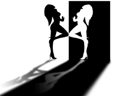 Woman silhouette on the door and in the lightの写真素材