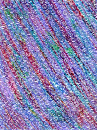 Abstract background with multicolored stripes. Grunge style background with colorful stripes with scratches and bubble. Diagonal lines of red, pink, purple, green, orange and blue.の写真素材