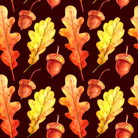 Seamless pattern with oak leaves and acorns. Watercolor autumn fallen leaves of orange and yellow with colorful drops and sprays on a dark brown background. Template for design.の写真素材