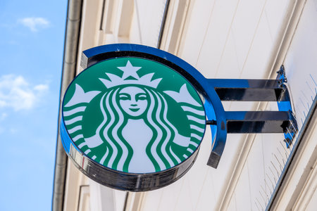Potsdam, Brandenburg/Germany - 24.03.2019: The Starbucks logo in green and white on a house wall in Potsdam directly over the Coffee Shop.のeditorial素材