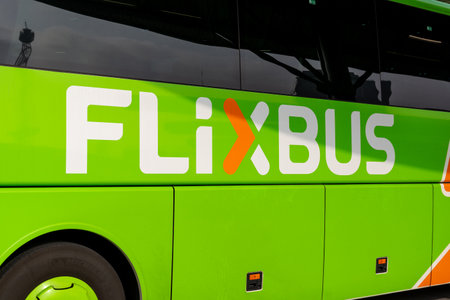 Berlin, Berlin/Germany - 24.03.2019: A coach with the lettering and logo Flixbus on the side in green.のeditorial素材