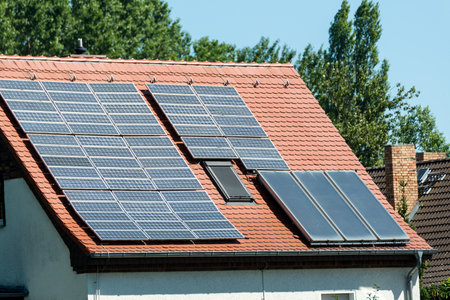 Berlin, Berlin/Germany - 07.23.2018: Various solar panels on a single-family house in the sunのeditorial素材