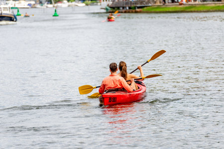 Berlin, Berlin/Germany - 07.23.2018: A kayak with two persons paddling from behind on a river in Berlin.のeditorial素材