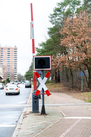 Level crossing with diagonal cross and barrier in one city.のeditorial素材