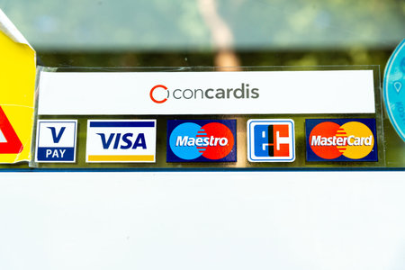Berlin, Berlin/Germany - 03.09.2019: A sticker on a glass pane with logos of different credit cards...
