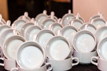 A large number of soup bowls, which are decorated and stacked twice, one soup bowl was placed upright in the otherの写真素材
