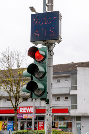 MÃ¼nster, Nordrhein-Westfalen-Germany - 01-04-2021: A red traffic light that has an electronic indication that you should turn off the engine. This is indicated time-controlled by the traffic light.のeditorial素材