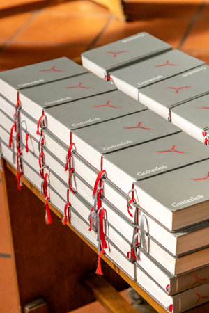 MÃ¼nster, Nordrhein-Westfalen-Germany - 01-04-2021: A stack of gray church hymn books intended for...
